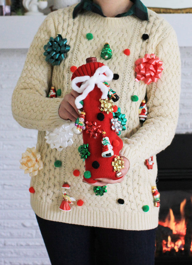 Final matching christmas sweaters and wine bottle