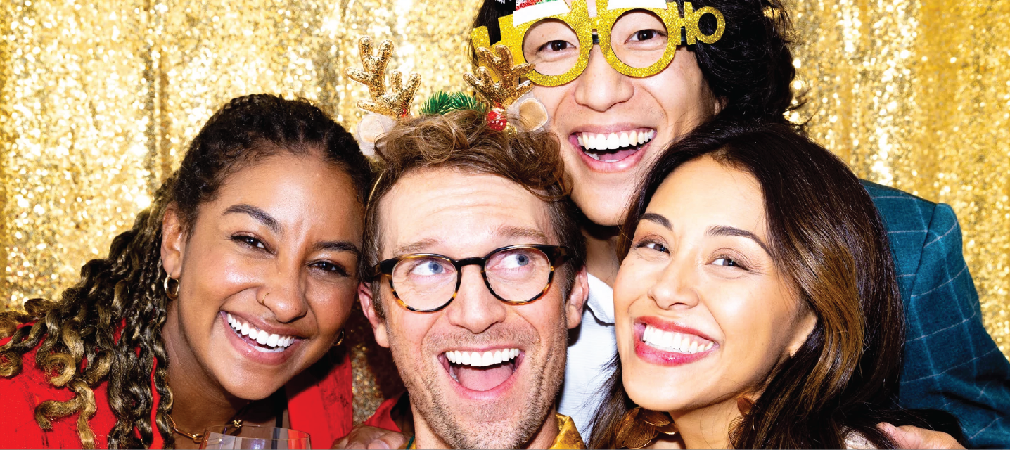 Friends Posing for a Photo in front of a gold glitter backdrop